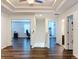 Hallway with wood-look flooring and recessed lighting, leading to different rooms at 1706 Leatherback Ln, St Cloud, FL 34771