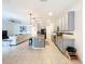 Spacious kitchen featuring gray cabinets, granite countertops, stainless steel appliances, and an island with seating at 1706 Leatherback Ln, St Cloud, FL 34771