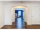 Open archway leading to bedroom with wood floors at 1706 Leatherback Ln, St Cloud, FL 34771