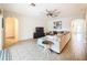 Open living room with neutral walls, tile flooring, and a large sectional sofa at 1706 Leatherback Ln, St Cloud, FL 34771