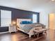Main bedroom showcasing modern design with hard wood flooring at 1706 Leatherback Ln, St Cloud, FL 34771
