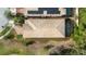 Aerial view of home's tile roof, screened-in pool, and surrounding yard at 1801 Nice Ct, Kissimmee, FL 34747