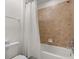 Bright bathroom with tiled shower-tub and modern fixtures at 1801 Nice Ct, Kissimmee, FL 34747
