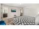Well lit bedroom with TV, two closets and entryways to the bathroom and hallway at 1801 Nice Ct, Kissimmee, FL 34747