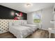 Charming bedroom featuring twin beds, whimsical decor, and natural light from a window at 1801 Nice Ct, Kissimmee, FL 34747