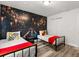 Comfortable bedroom with twin beds, Harry Potter themed decor, and ample natural light at 1801 Nice Ct, Kissimmee, FL 34747