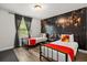 Cozy bedroom featuring twin beds, unique themed decor, and natural light from a window at 1801 Nice Ct, Kissimmee, FL 34747