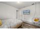 Bright bedroom featuring wood-look floors, a comfy hanging chair and a wall mounted TV at 1801 Nice Ct, Kissimmee, FL 34747