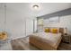 Bright bedroom featuring a bed, stylish hanging chair, and natural light from a window at 1801 Nice Ct, Kissimmee, FL 34747