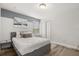 Nicely decorated bedroom with wood-look floors, neutral colored walls and lots of natural light at 1801 Nice Ct, Kissimmee, FL 34747