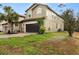 Two-story home featuring a neutral color scheme, attached garage, and well-manicured lawn at 1801 Nice Ct, Kissimmee, FL 34747