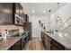 Well-equipped kitchen with granite countertops, stainless steel appliances, and modern design at 1801 Nice Ct, Kissimmee, FL 34747