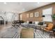 Warm-toned living room with modern furnishings, stylish rug, and comfortable seating arrangement at 1801 Nice Ct, Kissimmee, FL 34747