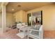 Covered patio with brick pavers, comfortable seating and access to the home's interior at 1801 Nice Ct, Kissimmee, FL 34747