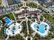 Resort aerial showcasing pools, a playground, and common spaces at 1929 Tropical Palms Cir, Kissimmee, FL 34747