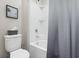 Bathroom featuring toilet, tub with shower, and decor at 1929 Tropical Palms Cir, Kissimmee, FL 34747