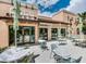 Outdoor patio area with a coffee shop, seating, and awnings for enjoying fresh air and refreshments at 1929 Tropical Palms Cir, Kissimmee, FL 34747