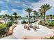 Outdoor community space with a fire pit surrounded by chairs, perfect for relaxing and socializing at 1929 Tropical Palms Cir, Kissimmee, FL 34747