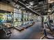 Well-equipped gym featuring treadmills, weights, and large windows for natural light at 1929 Tropical Palms Cir, Kissimmee, FL 34747