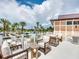 Outdoor patio with comfortable seating and views of a park with palm trees at 1929 Tropical Palms Cir, Kissimmee, FL 34747