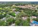 An aerial view of the property including a large estate and the surrounding neighborhood at 202 Sweetwater Club Blvd, Longwood, FL 32779
