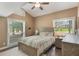 Bedroom featuring natural light, ceiling fan, and light neutral colored walls at 202 Sweetwater Club Blvd, Longwood, FL 32779