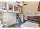 This bedroom features a loft area, wood-look floors, and a modern ceiling fan, blending functionality with unique design elements at 202 Sweetwater Club Blvd, Longwood, FL 32779