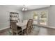 Elegant dining room with natural light, setting the stage for memorable gatherings with friends and Gathering at 202 Sweetwater Club Blvd, Longwood, FL 32779