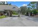 Community entrance featuring beautiful landscaping and private roads at 202 Sweetwater Club Blvd, Longwood, FL 32779