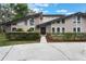 Charming front exterior with a well-maintained lawn, stylish stone accents, and a modern design at 202 Sweetwater Club Blvd, Longwood, FL 32779