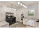 Well-lit laundry room with modern washer and dryer, ample cabinetry, and stylish countertop for efficient chores at 202 Sweetwater Club Blvd, Longwood, FL 32779