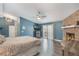 Beautiful main bedroom with wood grain floors, stone fireplace, and large sliding doors to screened area at 202 Sweetwater Club Blvd, Longwood, FL 32779