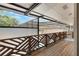 Screened porch includes wood railing and screening providing stunning views of surrounding landscape at 202 Sweetwater Club Blvd, Longwood, FL 32779