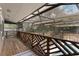 Large screened porch features beautiful wood railings and tranquil views of backyard and pool at 202 Sweetwater Club Blvd, Longwood, FL 32779