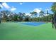 Exterior photo of two tennis courts and a basketball court in a gated community at 202 Sweetwater Club Blvd, Longwood, FL 32779