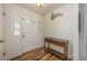 Inviting entryway with decorative door and wood-look floors at 208 Madeira Ave, Orlando, FL 32825