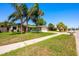 Charming single-story home with a well-manicured lawn, mature trees, and a cozy, inviting curb appeal at 208 Madeira Ave, Orlando, FL 32825