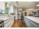 Open kitchen featuring a large island, stainless appliances, and modern finishes at 208 Madeira Ave, Orlando, FL 32825