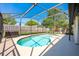 The pool is fully screened and private with outdoor furniture, perfect for enjoying the backyard in the sun or shade at 208 Madeira Ave, Orlando, FL 32825