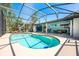 Inviting screened-in pool with ample deck space, perfect for outdoor lounging and entertaining in a private backyard at 208 Madeira Ave, Orlando, FL 32825