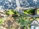 Aerial shot showcases a private backyard with lush green landscaping at 2162 Lake Howell Preserve Ct, Maitland, FL 32751