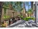 Inviting backyard patio with comfortable seating, surrounded by lush greenery and a privacy fence at 2162 Lake Howell Preserve Ct, Maitland, FL 32751