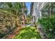 Beautiful backyard featuring lush greenery, privacy fence, and well-maintained landscaping, ideal for relaxation at 2162 Lake Howell Preserve Ct, Maitland, FL 32751