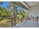 Serene balcony view of trees and a tranquil creek below at 2162 Lake Howell Preserve Ct, Maitland, FL 32751