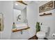 This stylish bathroom features a unique vessel sink, wood accents, and sleek fixtures at 2162 Lake Howell Preserve Ct, Maitland, FL 32751