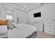 Bright bedroom featuring neutral tones, recessed lighting, and a wall-mounted television at 2162 Lake Howell Preserve Ct, Maitland, FL 32751
