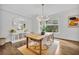 Bright dining room with modern light fixture, wooden table, and stylish decor at 2162 Lake Howell Preserve Ct, Maitland, FL 32751