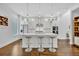 Bright, modern kitchen with white cabinets, stainless steel appliances, and an island with seating at 2162 Lake Howell Preserve Ct, Maitland, FL 32751