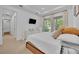 Comfortable bedroom with a view of the surrounding trees at 2162 Lake Howell Preserve Ct, Maitland, FL 32751