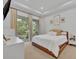 Well-lit bedroom with balcony access and modern decor at 2162 Lake Howell Preserve Ct, Maitland, FL 32751
